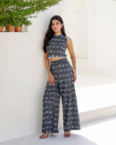 Model wearing Bolbo Midnight Muse gray camel print coord set featuring sleeveless crop top and wide-leg pants – front view.