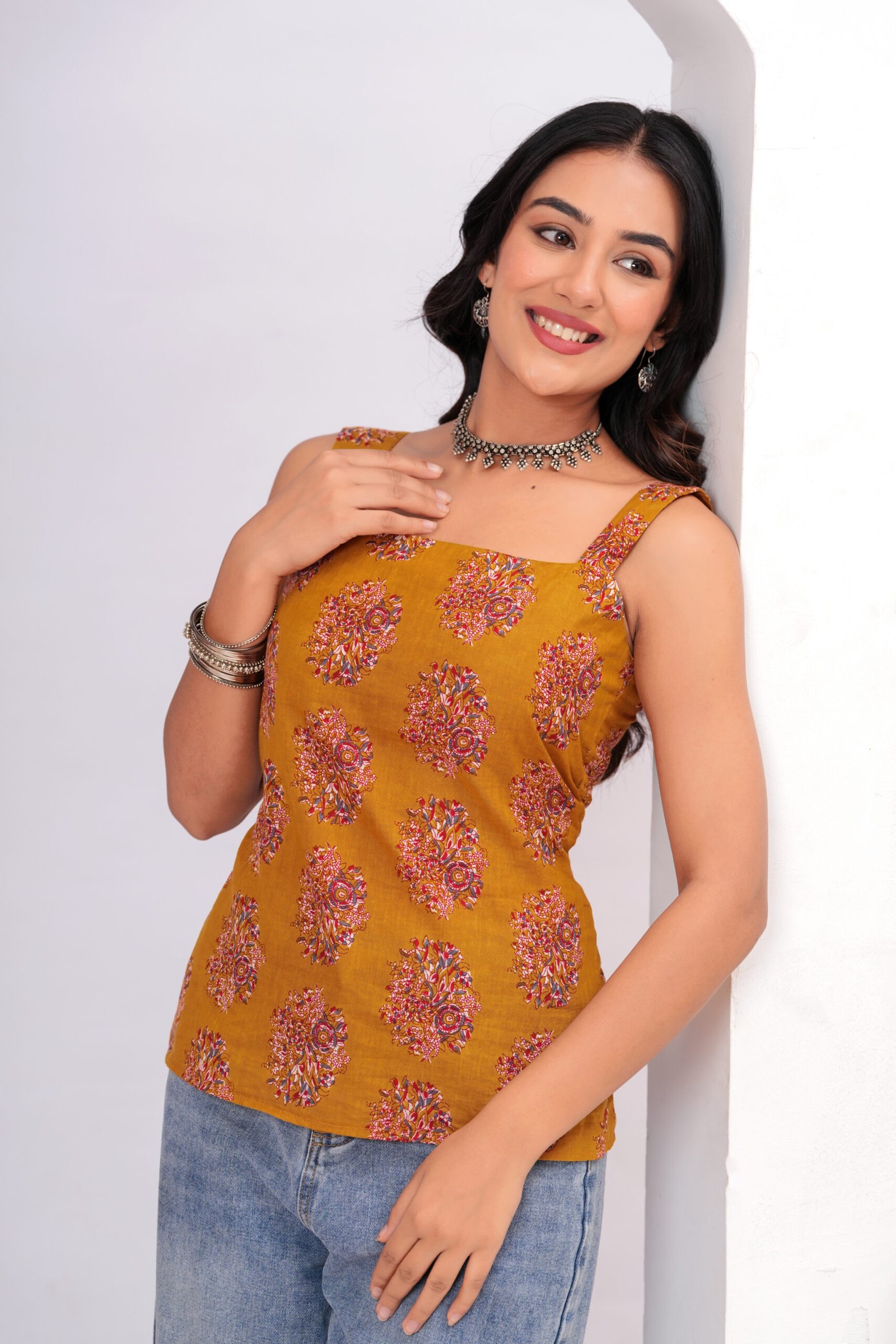 Women Mustard Printed Sleeveless Cotton short kurti with Lace-Up Back
